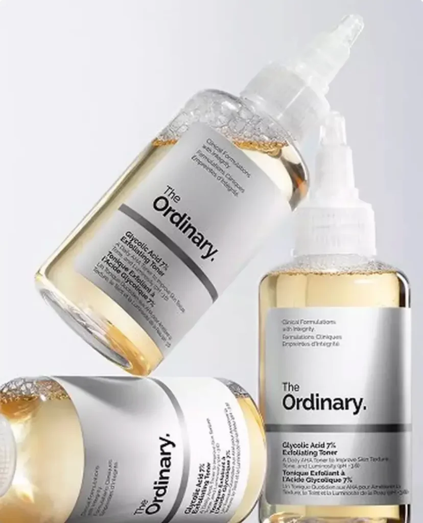 Three bottles of The Ordinary Glycolic Acid 7% Exfoliating Toner arranged at different angles against a light gray background.