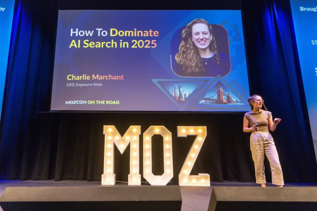 Charlie Marchant, SEO speaker from Exposure Ninja, on stage at MozCon London 2026 delivering talk on How To Dominate AI Search in 2025