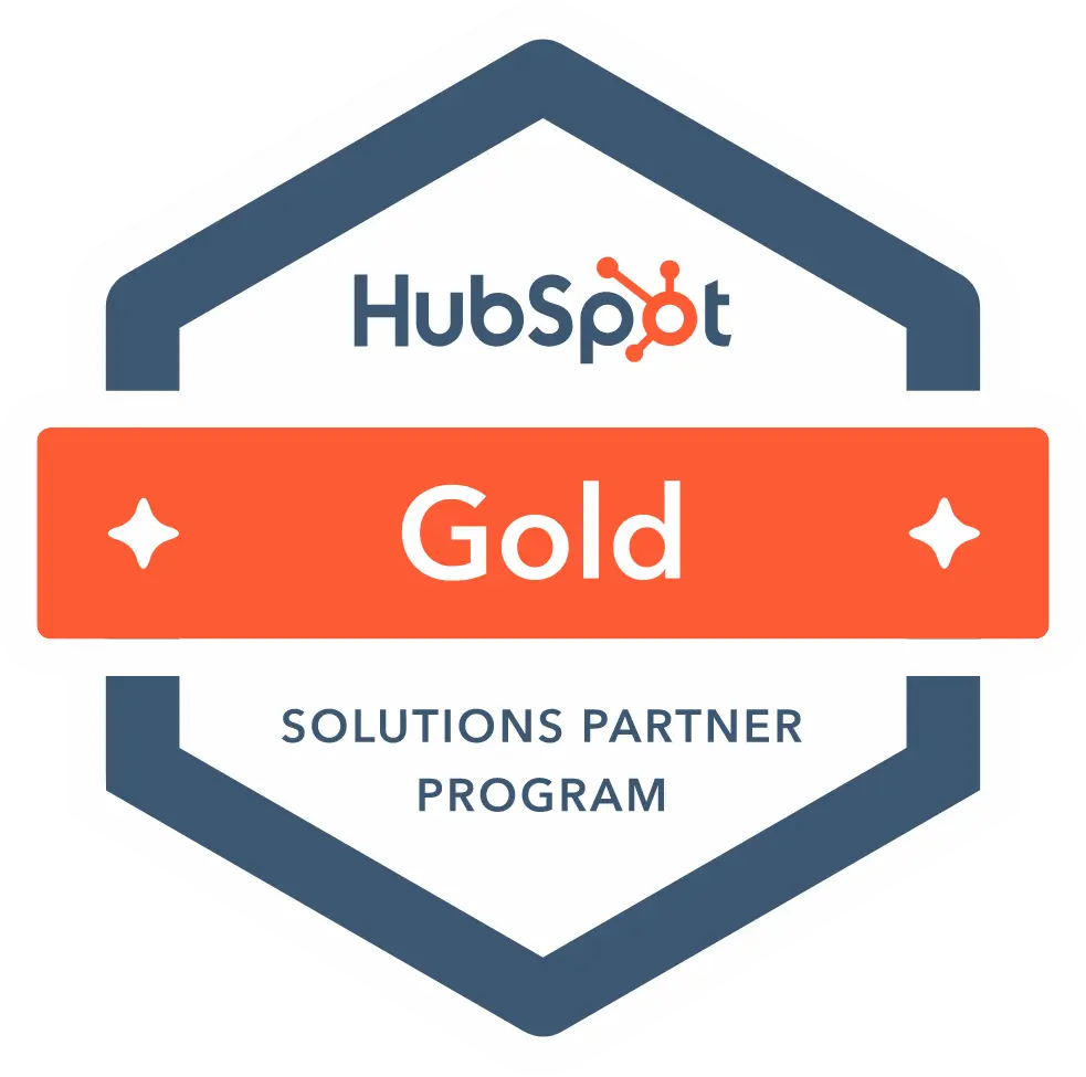 HubSpot Gold Solutions Partner Program badge in a hexagonal shape with navy blue and orange coloring.