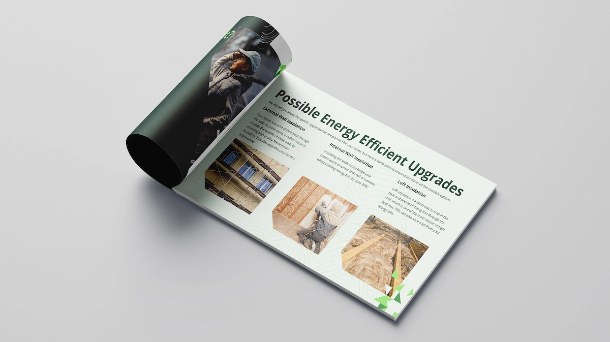 A rolled brochure open to a page titled "Possible Energy Efficient Upgrades," featuring sections on wall insulation and loft insulation with construction photos.
