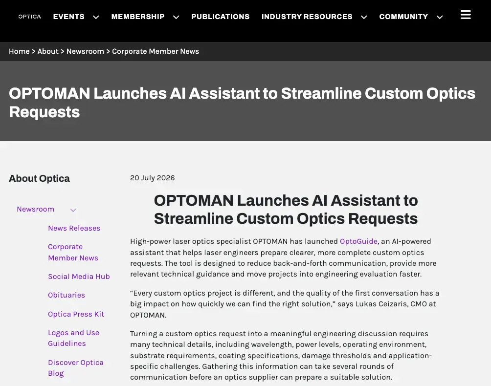 Optica news page announces OPTOMAN’s AI assistant, OptiGuide, for streamlining custom optics requests; a clean, informative layout conveys a professional tone.